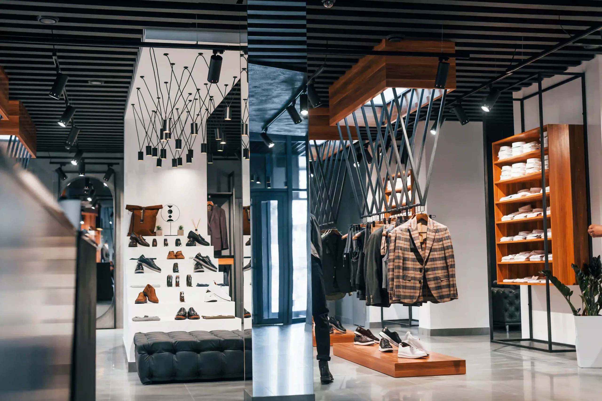 Layered Lighting In A Retail Store Using A Combination Of 4000k And 5000k To Create A Dynamic Shopping Experience.