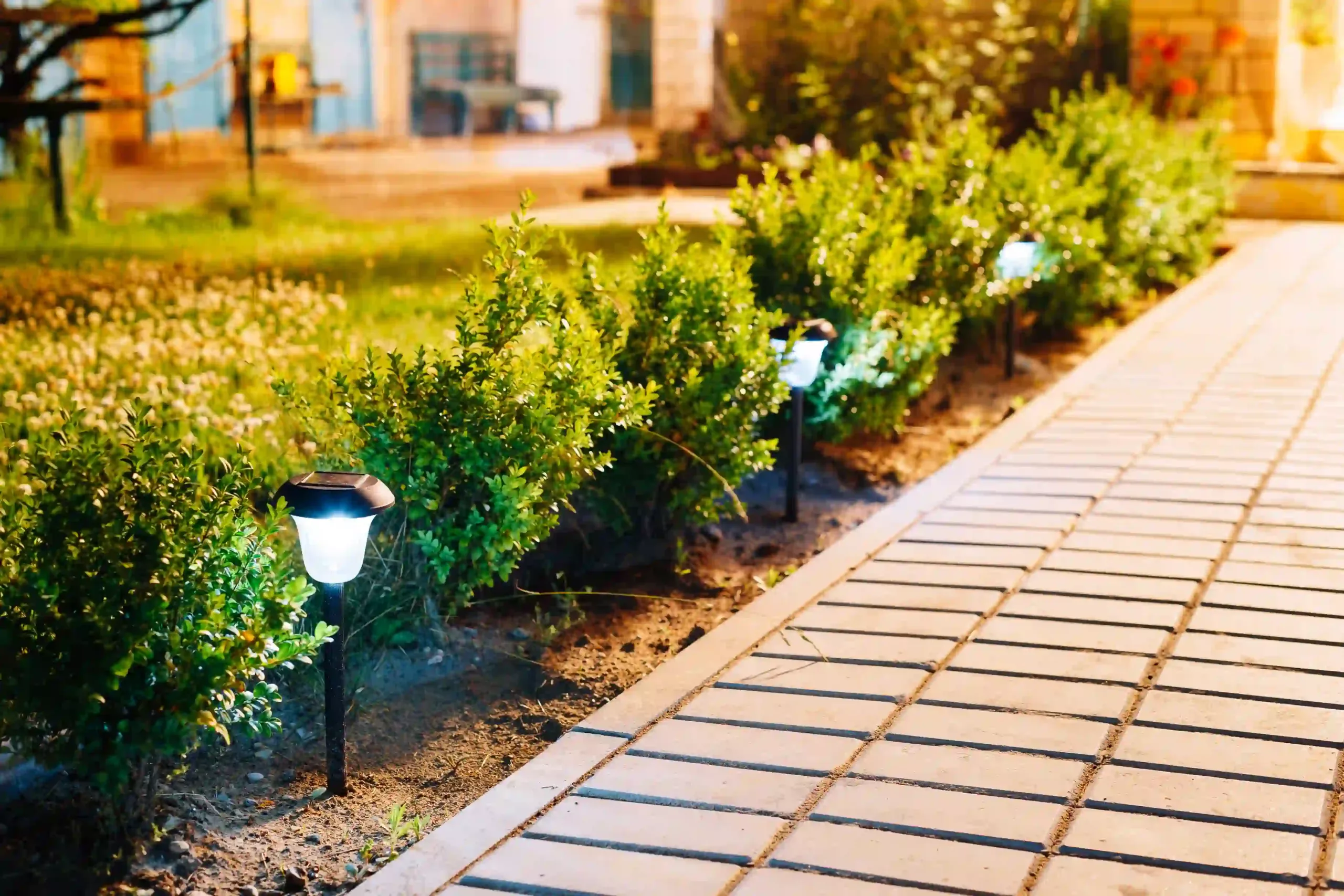 A Solar Light Being Installed In A Garden Path, Showcasing The Simplicity Of The Process.