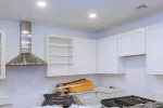 Show how ceiling LED lights in a kitchen provide focused task lighting for countertops and kitchen islands