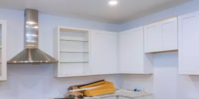 Show how ceiling LED lights in a kitchen provide focused task lighting for countertops and kitchen islands